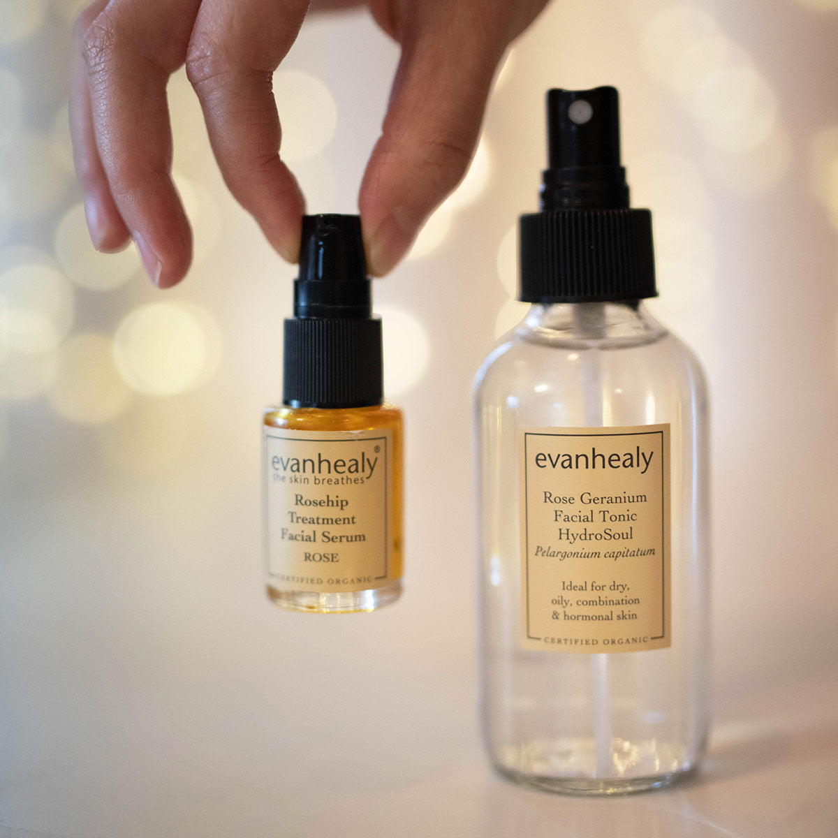 evanhealy balancing ritual with rosehip rose oil serum in fingertips
