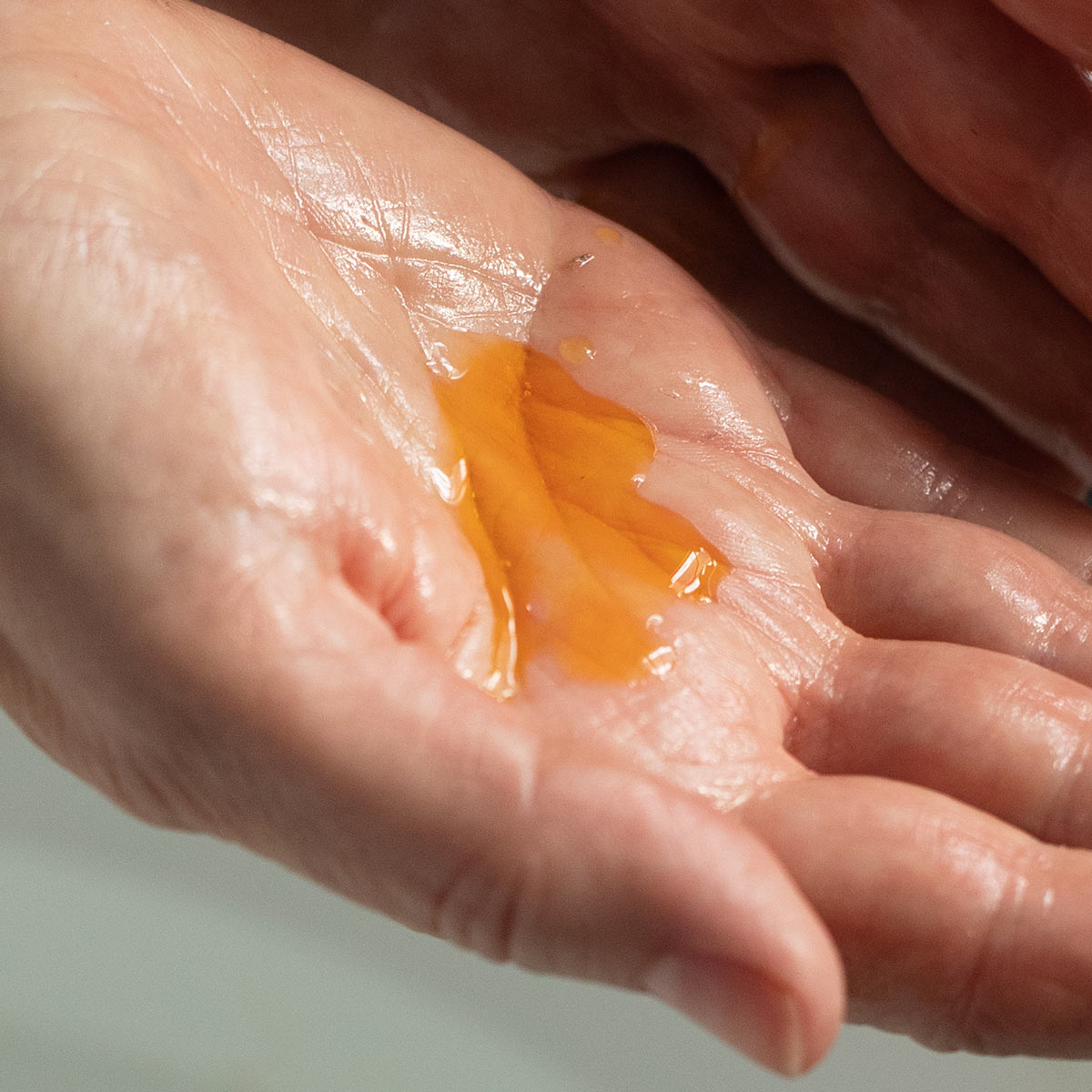 palm full of orange facial oil serum