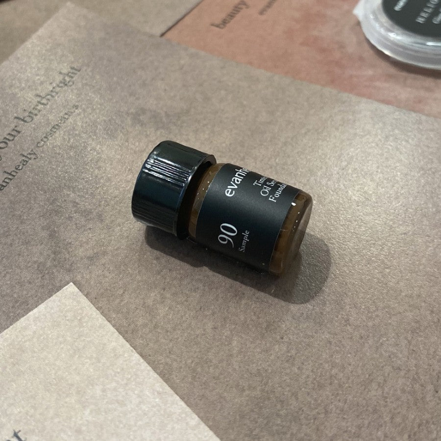 evanhealy tinted oil serum foundation sample bottle on surface