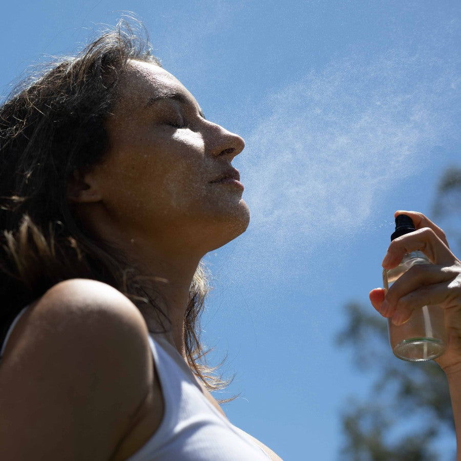 evanhealy facial tonic hydrosol spray on face outdoors in the sun