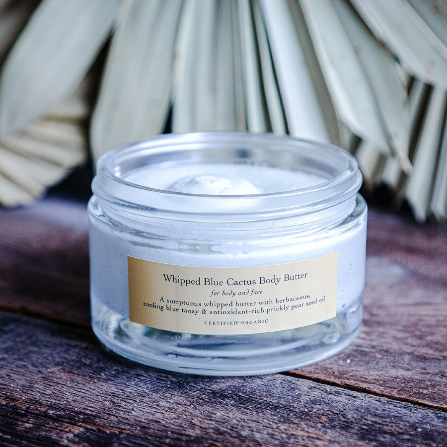 blue cactus body butter on wooden surface