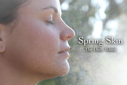 Woman with water mist and droplets on her face, eyes closed outdoors, text overlay ‘Spring Skin The Daily Ritual’