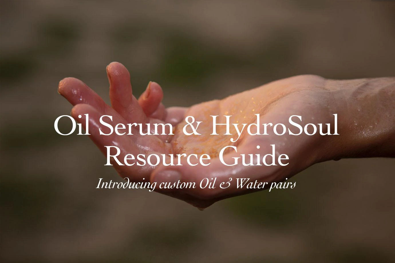 Cupped wet hand with water droplets against a soft blurred background, header image for an oil and hydrosol resource guide