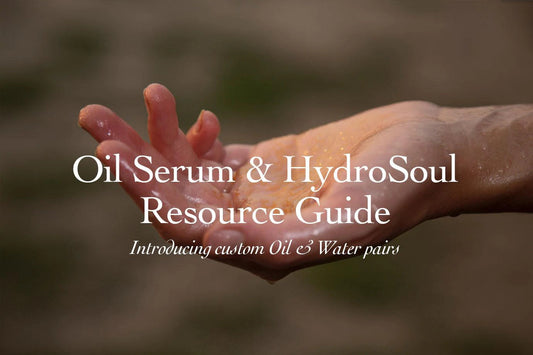 Cupped wet hand with water droplets against a soft blurred background, header image for an oil and hydrosol resource guide
