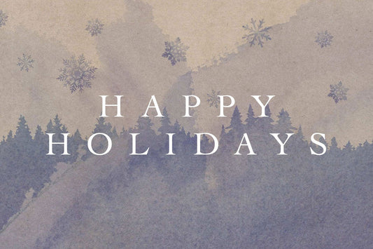 Banner showing large centered text “HAPPY HOLIDAYS” over a watercolor pine-forest silhouette and scattered snowflakes