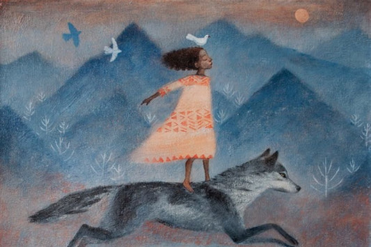 Girl balancing with arms outstretched on a running gray wolf before misty blue mountains with birds flying overhead