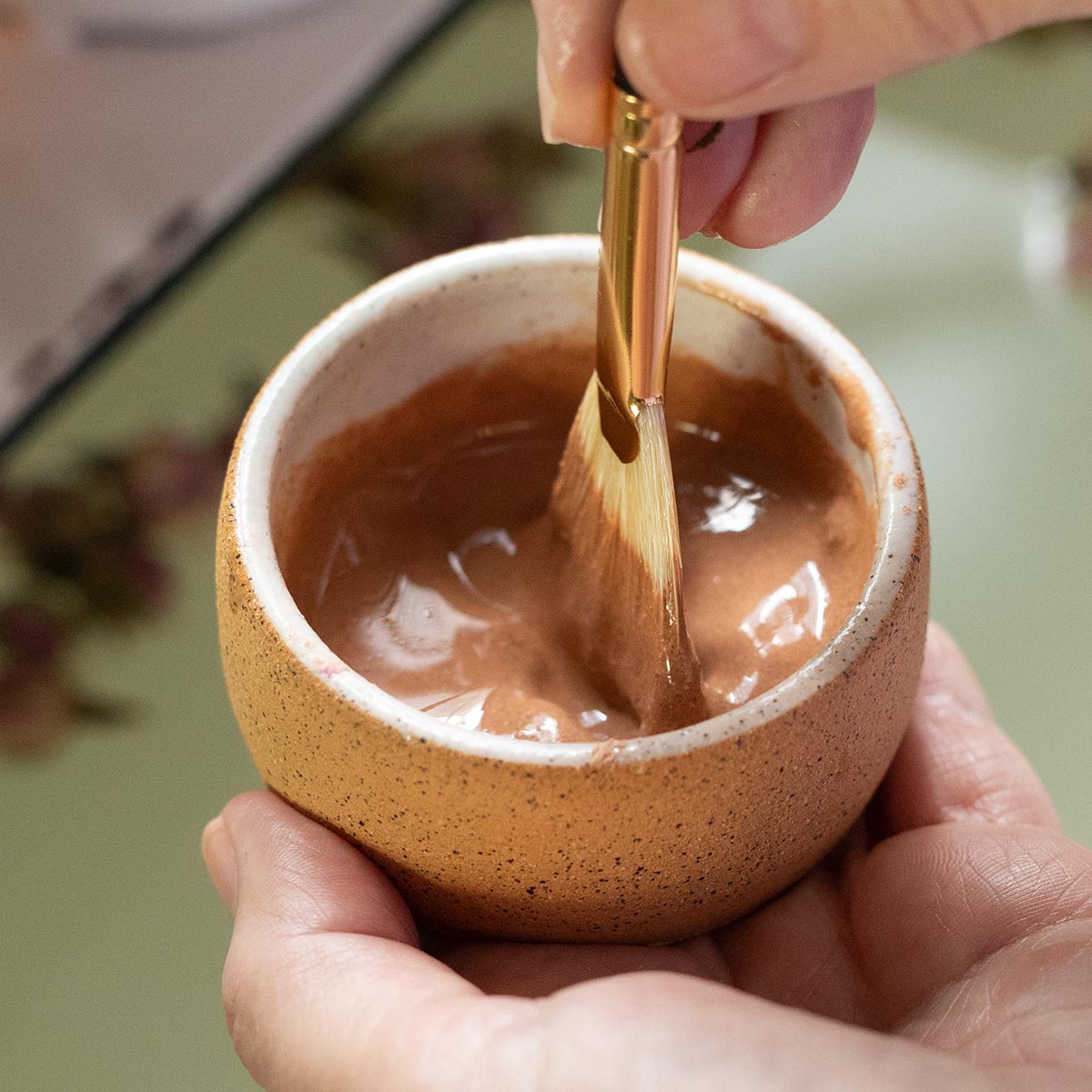 clay mixing in ceramic bowl with fan mask brush