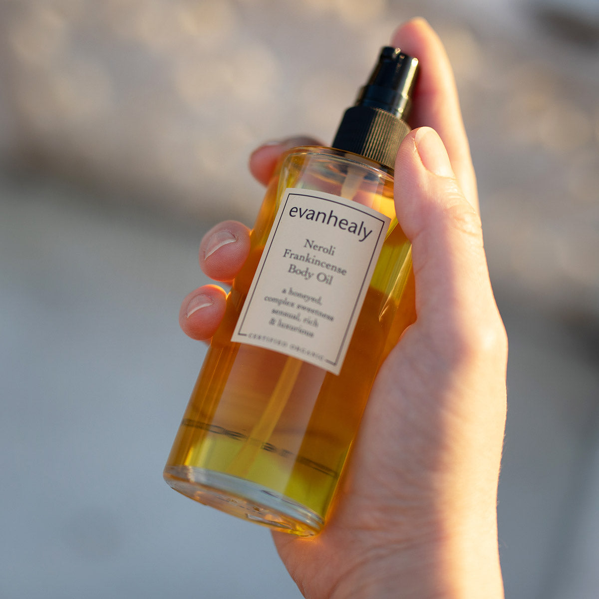 neroli frankincense size reference in hand of model