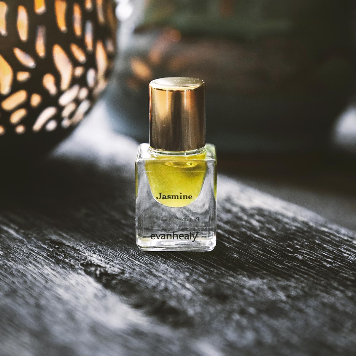 evanhealy jasmine essential oil perfume on wood table