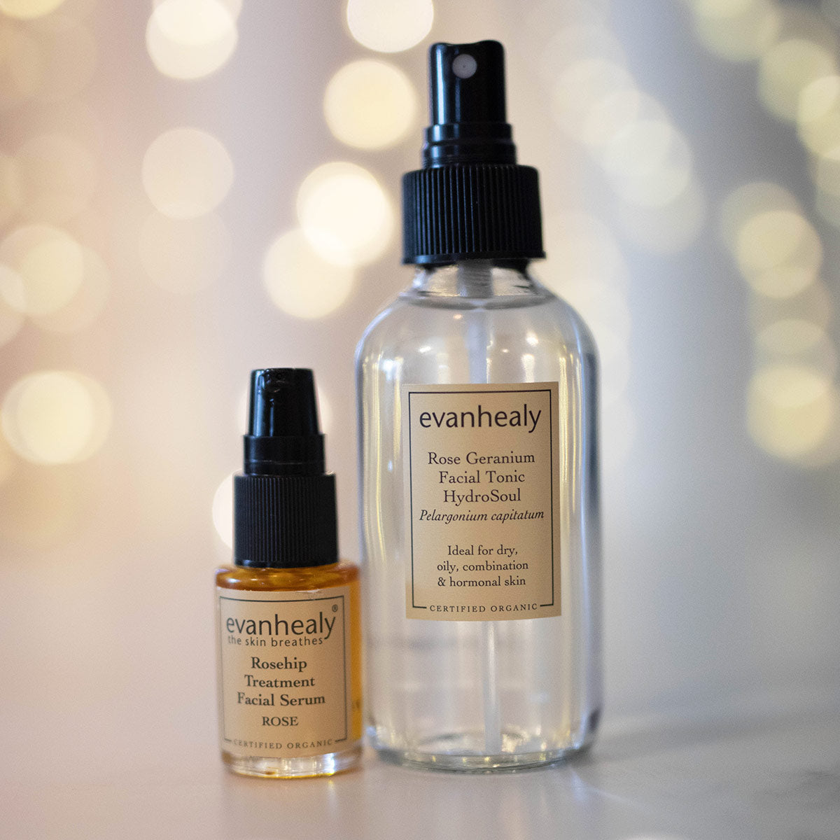 evanhealy rosehip rose oil serum and rose geranium hydrosol with twinkling lights