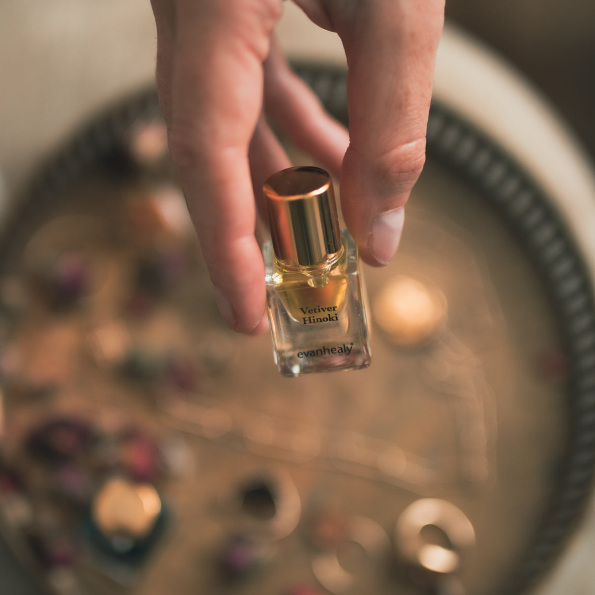 vetiver hinoki perfume in fingertips